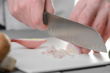 Man chopping an onion