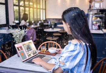 woman using laptop computer online shopping.