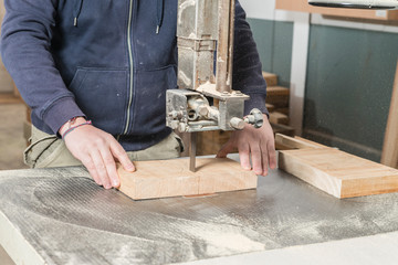 Male carpenter working in his carpentry workshop.