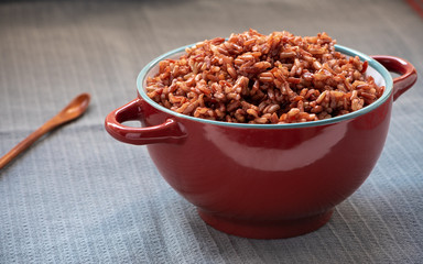 Cooked red rice on the table. Vegetarian food. Healthy food.