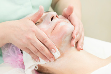 Process cosmetic mask of massage and facials in beauty salon 