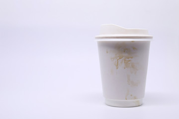 dirty brown stain on take away cup for hot coffee drink, paper mug on white background