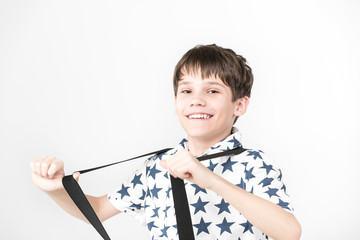 Portrait of an emotional boy on a white background.