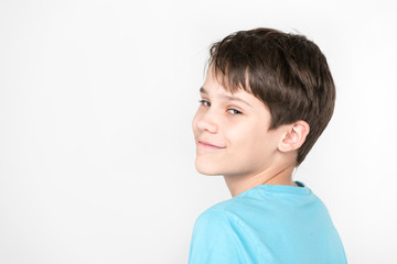 Portrait of an emotional boy on a white background.