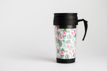 Thermos in the form of a thermomug on a white background