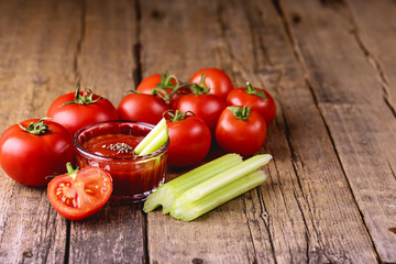 Bowl of Tomato Celery Sauce on Wooden Background Fresh Celery and Tomatoes