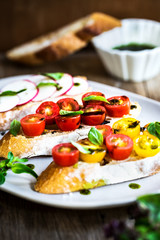 Bruschetta with Cherry Tomatoes and Radish with Basil oil,