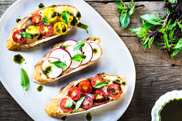 Bruschetta with Cherry Tomatoes and Radish with Basil oil,