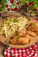 Chicken nuggets with yellow beans.