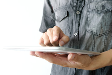 hands of people are using the tablet to find information and to entertain on black...