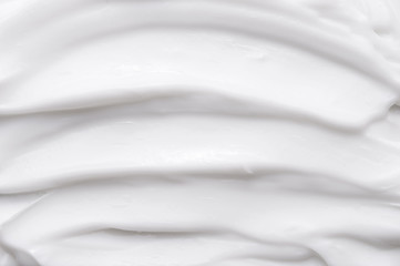 Fototapeta na wymiar White texture of cosmetic body care cream background