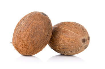 two whole tasty coconuts isolated on white background