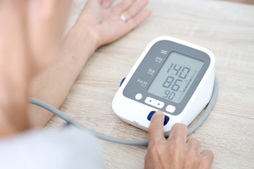 Man check blood pressure monitor and heart rate monitor with digital pressure gauge. Health care...