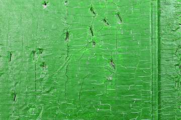 Old wooden background with remains of pieces of scraps of old paint on wood. Texture of an old tree, vintage wood background peeling paint. old blue board with cracked paint