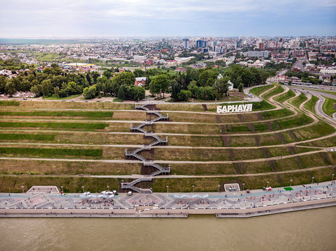 Barnaul, Russia. Description of Barnaul at the entrance to the city. Highland Park and a new embankment is the top view in summer.