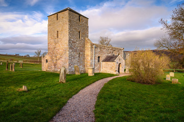 Fototapeta na wymiar St John the Baptist Church at Edlingham, a medieval church set in the hamlet of Edlingham in the Northeast English county of Northumberland