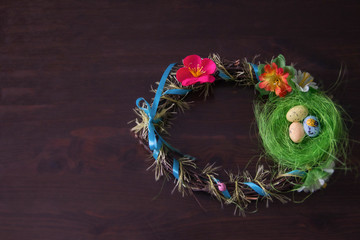Easter nest  and Eggs Wreath On wooden  Background