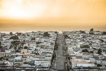 View of the sunset district of San Francisco as a rain storm moves in at sunset - obrazy, fototapety, plakaty