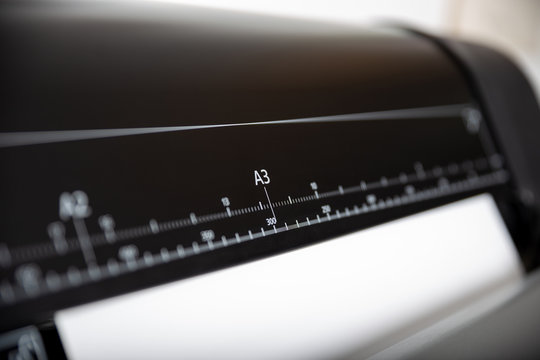 Large printer format inkjet printer ruller with paper dimenzion ruller. Focus on A3 size