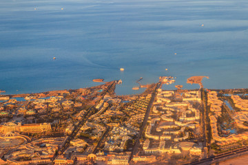 Aerial view on Red sea and Hurghada city, Egypt. View from airplane