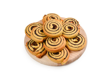 Baked cookies with raisins and poppy seeds isolated on white background.