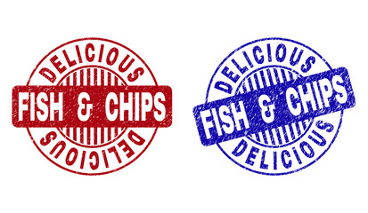 Grunge DELICIOUS FISH & CHIPS round stamp seals isolated on a white background. Round seals with grunge texture in red and blue colors.