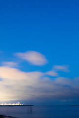 Naklejka na ściany i meble beach blue sky and clouds at night