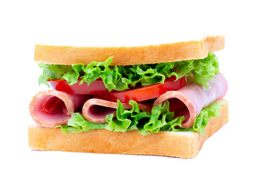 Isolated homemade fresh sandwich with ham and vegetables on white background