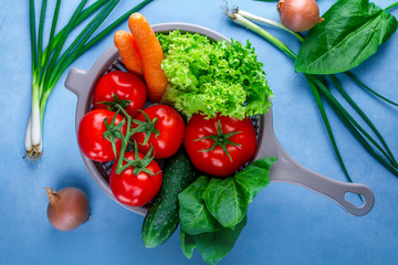 Washing vegetables. Сlean, ripe vegetables in colander for cooking fresh salad. Healthy food and proper nutrition. Balanced diet.