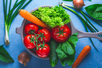 Washing vegetables. Сlean, ripe vegetables in colander for cooking fresh salad. Healthy food and proper nutrition. Balanced diet.