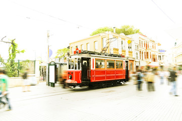 Fototapeta na wymiar Old red tram goes on Istiklal street 