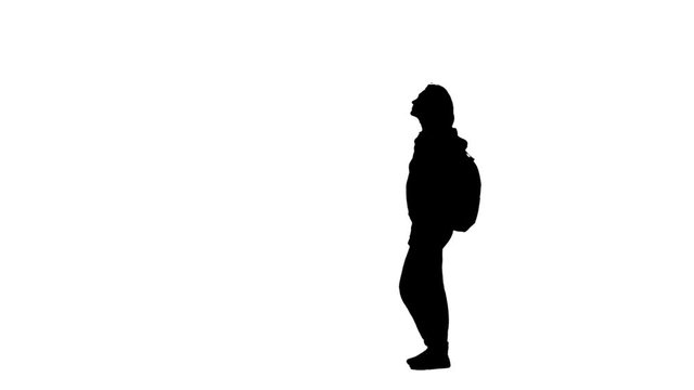 Tourist clapping her hands showing thumbs up. Silhouette. White background. Side view