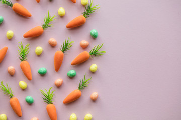 Easter lay flat composition with easter eggs and carrots