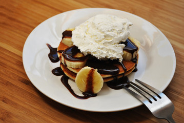 Banana Pancakes with Chocolate Sauce and Ice Cream 