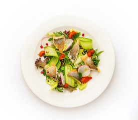 Healthy vegetable salad with fish. Top view on white background