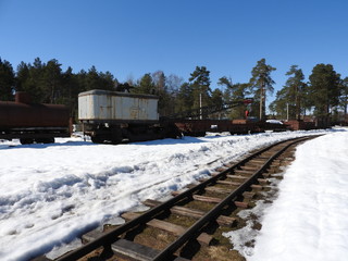 Old narrow gauge railway close-up in winter.