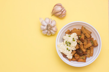 Fried Rye bread croutons with garlic and sauce. Top view, copy text