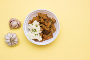 Fried Rye bread croutons with garlic and sauce. Top view, copy text
