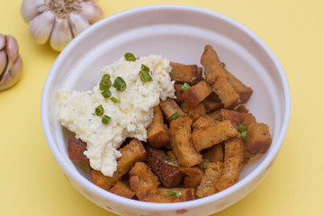 Fried Rye bread croutons with garlic and sauce. Top view, copy text