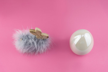 Easter bunny with fluffy feathers and big white easter egg...Modern decoration elements for easter...