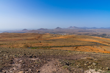 Spain, Lanzarote, Endless view from a mountain over many volcanic mounts