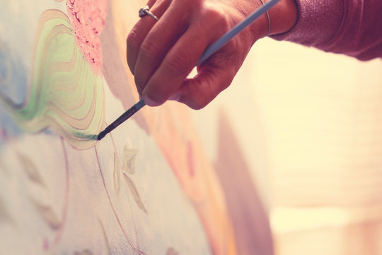 Closeup Of Woman Hand Painting An Art Wallpaper With Old Style - Creativity And Artist At Work For Hobby Or Job - Colors And Background Concept