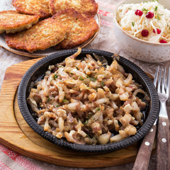 Baked pork ears with sauce and garlic.