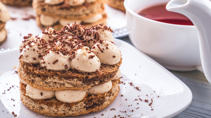 Tasty  Tiramisu dessert with cup of tea. Delicious Italian dessert