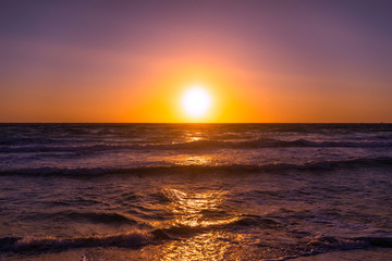 Naklejka na ściany i meble Sunset and sea on the beach Falasarne, Greece, Crete