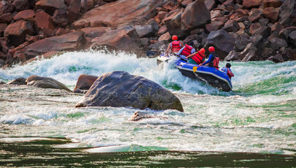 White water river rafting in Rishikesh, India. Sports activity by group of tourist.