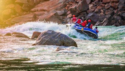 adventure water sports, white water rafting in River Ganges Rishikesh India. Raft in action image  
