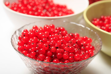 Fresh red currants in bowls close up