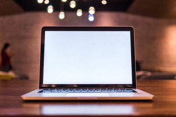 Conceptual workspace, Laptop computer with blank white screen on table, blurred background. use in Traditional Chinese Alphabet operating system.