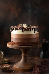 no baked layered cheesecake Three Chocolates on cake stand